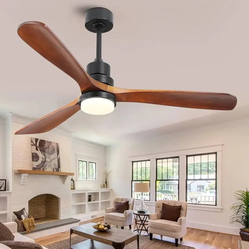 Modern living room with a ceiling fan featuring wooden blades and a built-in light fixture, above a seating area and fireplace.